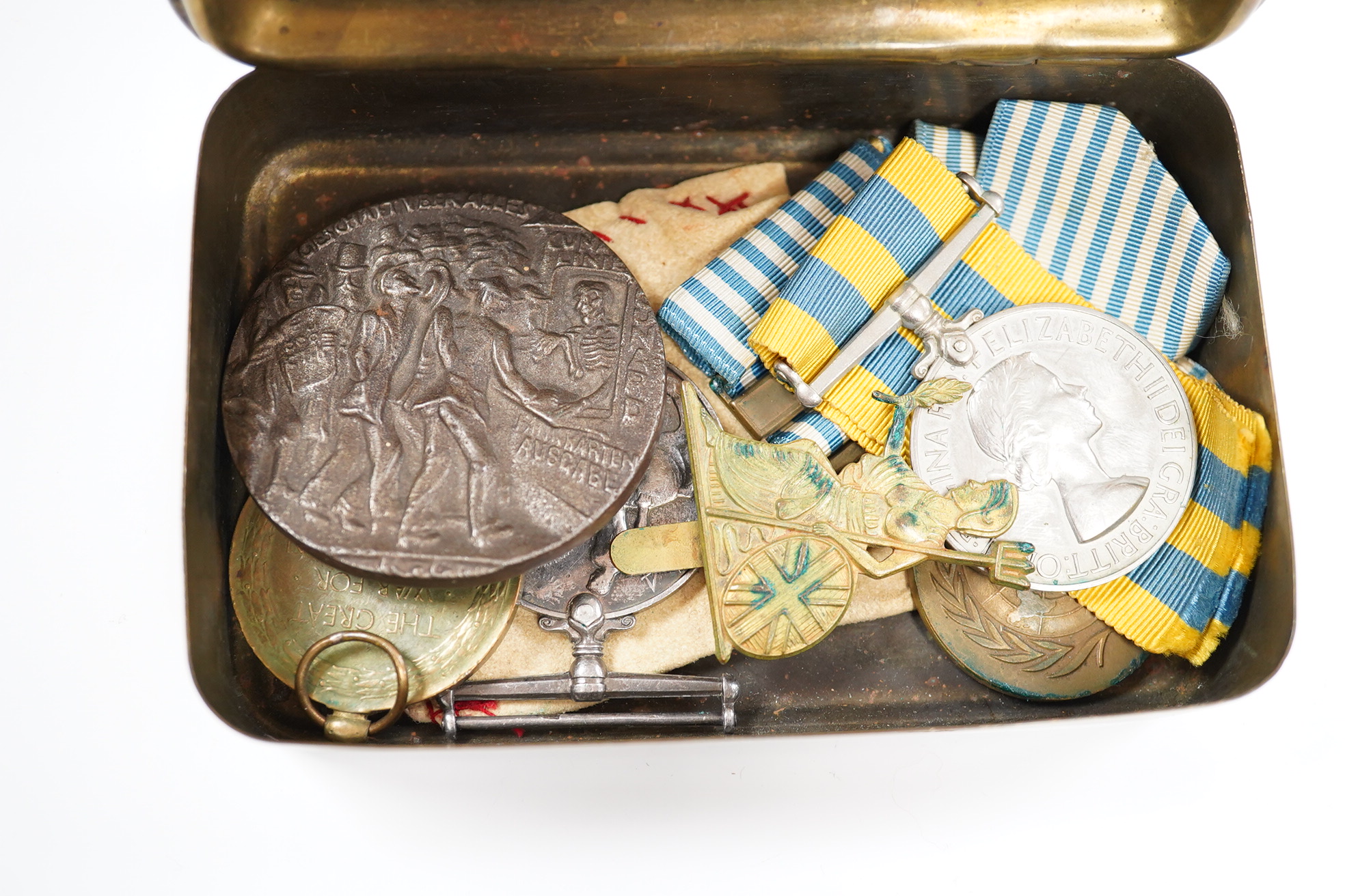 A First World War medal pair awarded to SJT. F.C. Howkins, The Queen’s R., together with a QEII Korea medal pair awarded to CPL. T.A. Howkins, R. Norfolk, plus a Lusitania propaganda medallion, all contained in a Princes